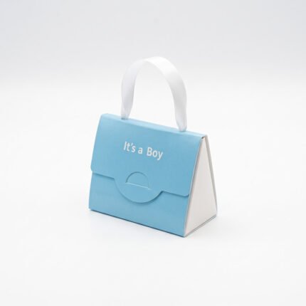 علبة توزيعات ولادة على شكل حقيبة – It's a Boy من متجر سنابل